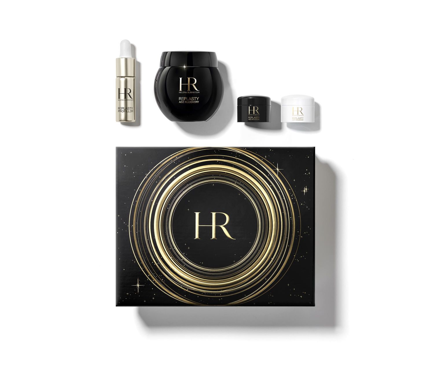 Coffret cadeau noir decore de spirales dorees et de motifs etoiles, ouvert pour reveler quatre produits Helena Rubinstein "Re-Plasty" a l'interieur, sur fond blanc.